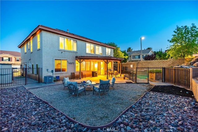40209 Chelsea Ct, Palmdale, CA 93551 - rear view of house featuring a fire pit, a patio area, stucco siding, and a fenced backyard