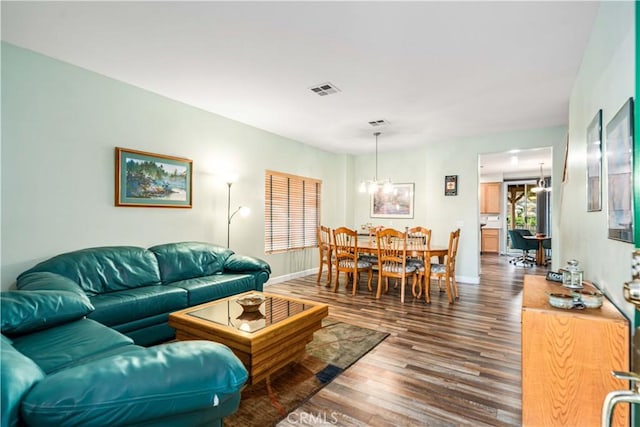40209 Chelsea Ct, Palmdale, CA 93551 - living area featuring dark wood-style floors and a chandelier