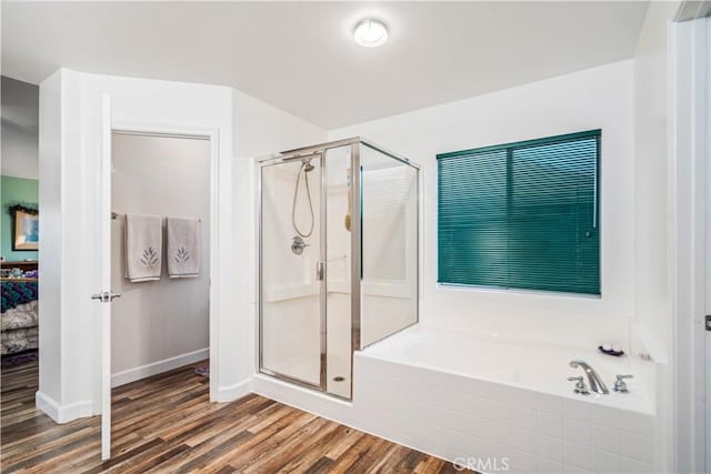 40209 Chelsea Ct, Palmdale, CA 93551 - full bathroom featuring a bath, a stall shower, and wood finished floors