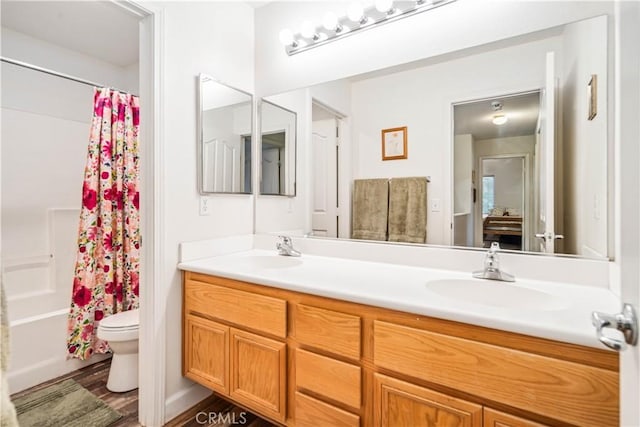 40209 Chelsea Ct, Palmdale, CA 93551 - bathroom featuring double vanity, shower / bath combo, and wood finished floors