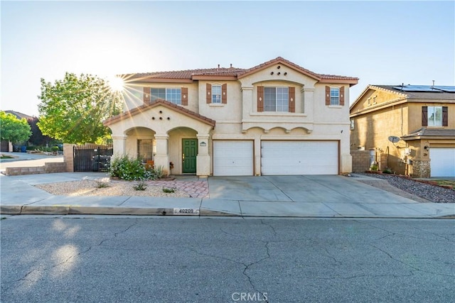 40209 Chelsea Ct, Palmdale, CA 93551 - mediterranean / spanish home featuring stucco siding, concrete driveway, and a garage