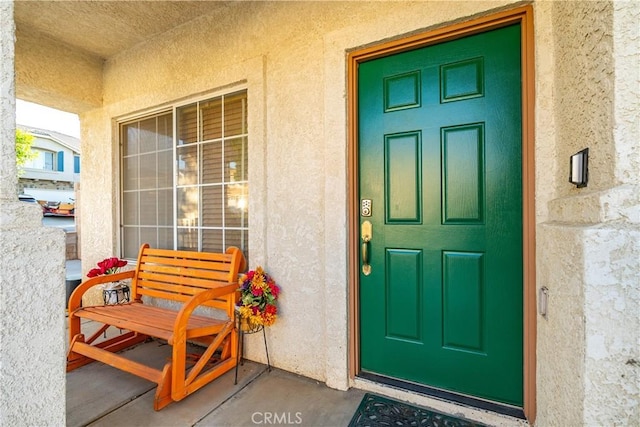 40209 Chelsea Ct, Palmdale, CA 93551 - view of exterior entry with a porch and stucco siding
