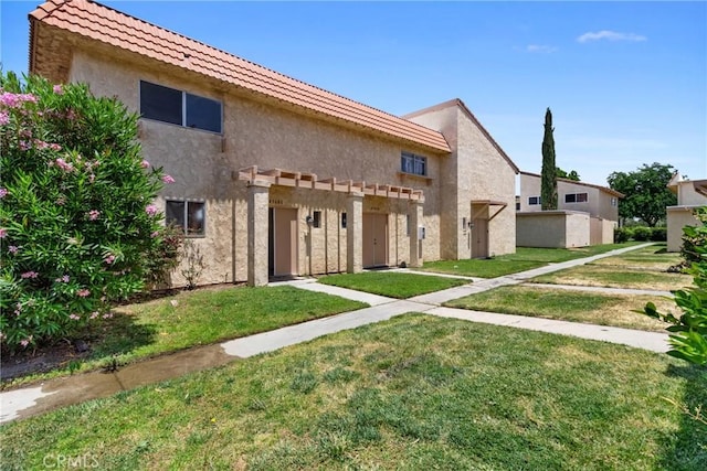 43606 Stanridge Ave, Lancaster, CA 93535 - view of front of home with a front yard and stucco siding