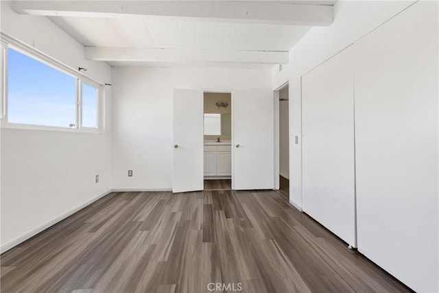43606 Stanridge Ave, Lancaster, CA 93535 - unfurnished bedroom with beamed ceiling, wood finished floors, and a closet