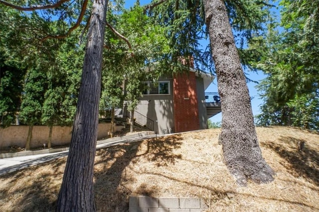 182 Darfo Dr, Crestline, CA 92325 - view of side of property with a chimney and brick siding