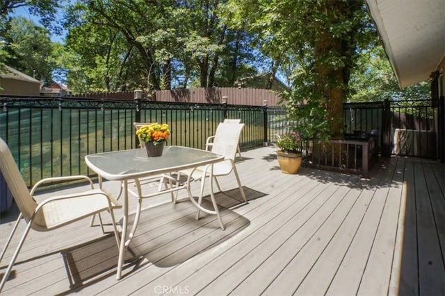 182 Darfo Dr, Crestline, CA 92325 - wooden deck featuring outdoor dining area and a fenced backyard