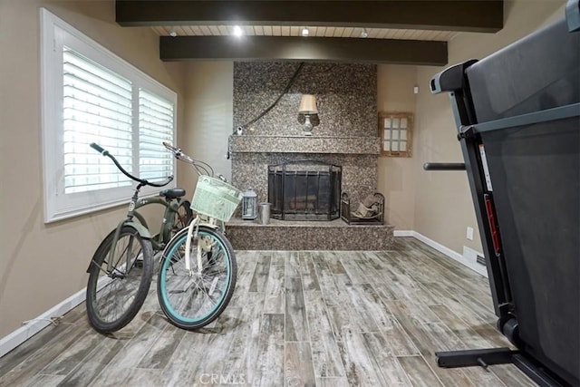 182 Darfo Dr, Crestline, CA 92325 - living room featuring beamed ceiling, wood finished floors, and a fireplace