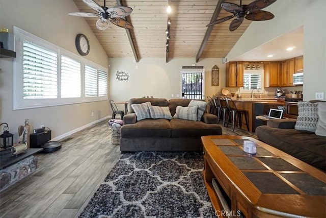 182 Darfo Dr, Crestline, CA 92325 - living room with ceiling fan, a wood ceiling with exposed beams, wood finished floors, high vaulted ceiling, and track lighting