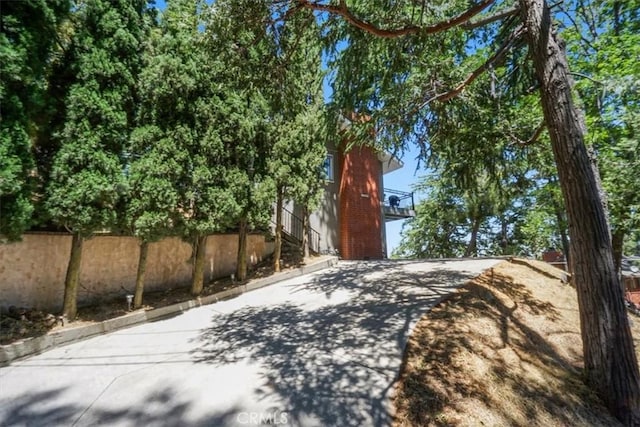 182 Darfo Dr, Crestline, CA 92325 - view of home's exterior with a chimney