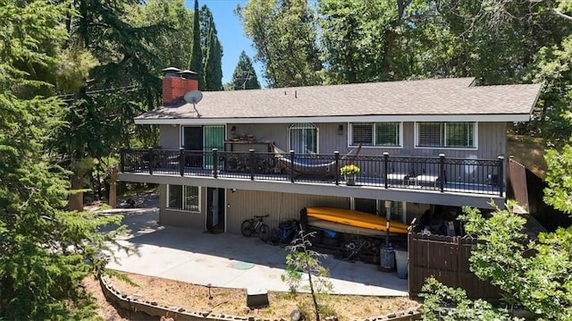 182 Darfo Dr, Crestline, CA 92325 - back of property with a patio area, a chimney, a deck, and roof with shingles