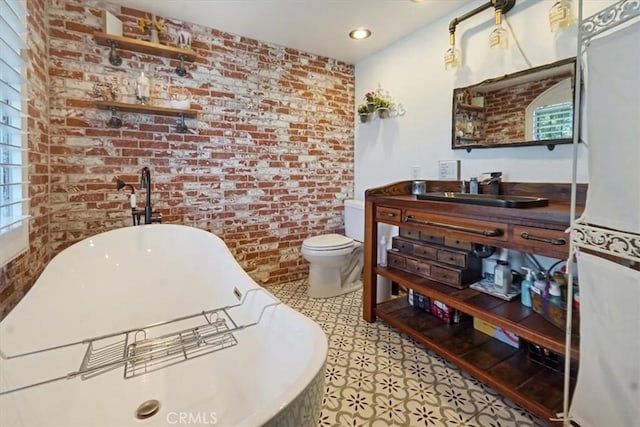 182 Darfo Dr, Crestline, CA 92325 - full bath with a soaking tub, brick wall, tile patterned floors, and vanity