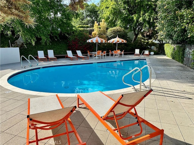 1701 Clinton St Unit 402, Los Angeles, CA 90026 - community pool with a patio area and view of scattered trees