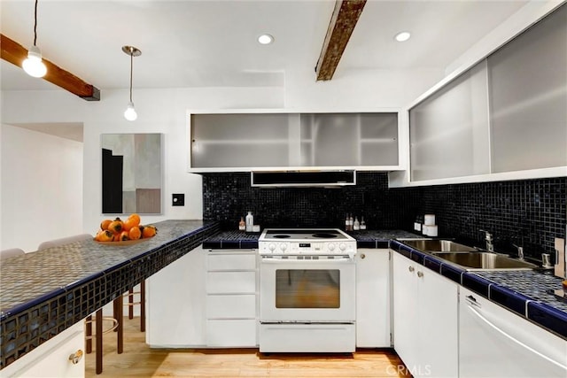 1701 Clinton St Unit 402, Los Angeles, CA 90026 - kitchen with white appliances, beam ceiling, decorative backsplash, light wood-style floors, and white cabinetry