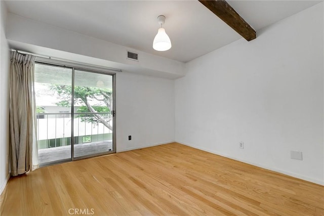 1701 Clinton St Unit 402, Los Angeles, CA 90026 - empty room featuring light wood-style flooring and beam ceiling