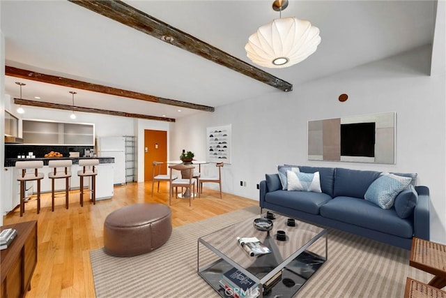 1701 Clinton St Unit 402, Los Angeles, CA 90026 - living area featuring beamed ceiling and light wood-style flooring