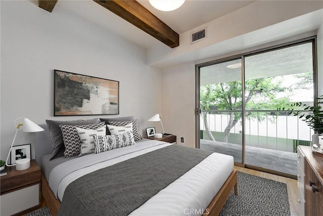 1701 Clinton St Unit 402, Los Angeles, CA 90026 - bedroom featuring access to exterior, wood finished floors, and beam ceiling