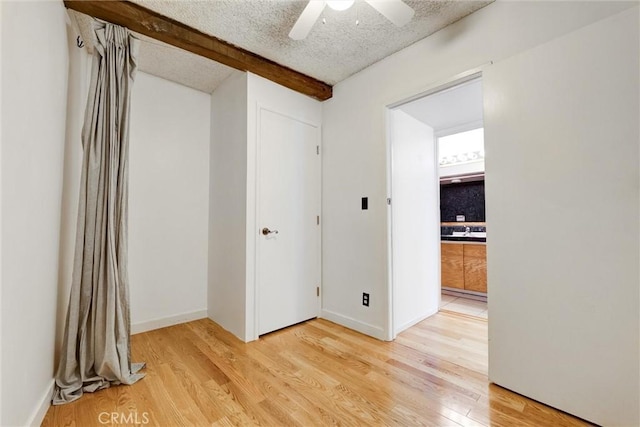 1701 Clinton St Unit 402, Los Angeles, CA 90026 - empty room with light wood finished floors, ceiling fan, and a textured ceiling