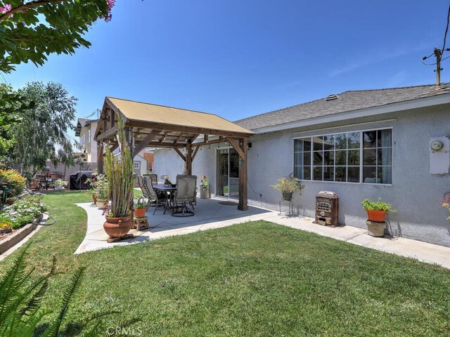 6364 Hancock Way, Buena Park, CA 90620 - rear view of property with a gazebo, stucco siding, a patio area, and roof with shingles