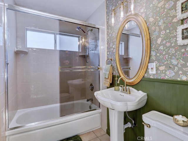 6364 Hancock Way, Buena Park, CA 90620 - full bathroom with wallpapered walls, a wainscoted wall, combined bath / shower with glass door, and tile patterned floors