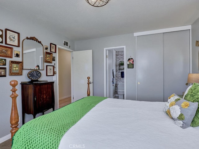 6364 Hancock Way, Buena Park, CA 90620 - bedroom with a closet, connected bathroom, and tile patterned flooring