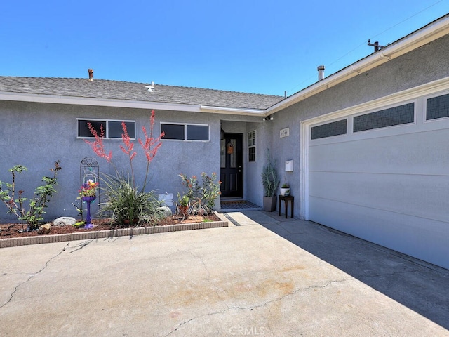 6364 Hancock Way, Buena Park, CA 90620 - entrance to property featuring stucco siding, an attached garage, concrete driveway, and a shingled roof