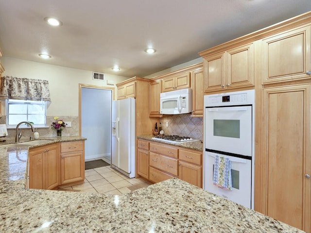 6364 Hancock Way, Buena Park, CA 90620 - kitchen featuring white appliances, light tile patterned flooring, backsplash, light brown cabinets, and light stone counters