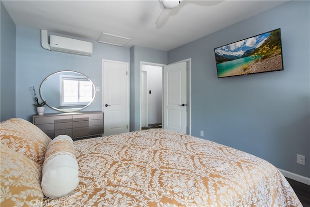 8527 Casaba Ave, Winnetka, CA 91306 - bedroom featuring a wall unit AC, attic access, wood finished floors, and ceiling fan