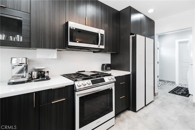 8527 Casaba Ave, Winnetka, CA 91306 - kitchen with stainless steel appliances, light countertops, and modern cabinets