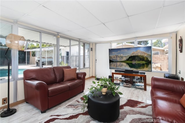 8527 Casaba Ave, Winnetka, CA 91306 - living area featuring a paneled ceiling and healthy amount of natural light