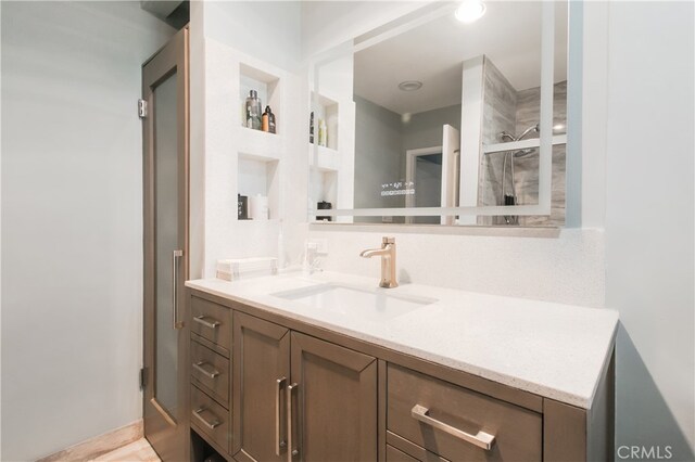 8527 Casaba Ave, Winnetka, CA 91306 - bathroom with vanity, built in features, and a shower with door