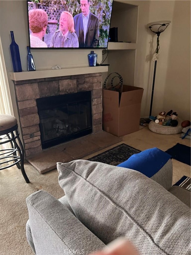 14106 Dartmouth St, Hesperia, CA 92344 - carpeted living area with a stone fireplace