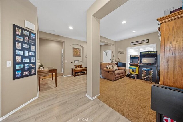 1410 Charles St, Banning, CA 92220 - living room featuring light wood-type flooring and recessed lighting