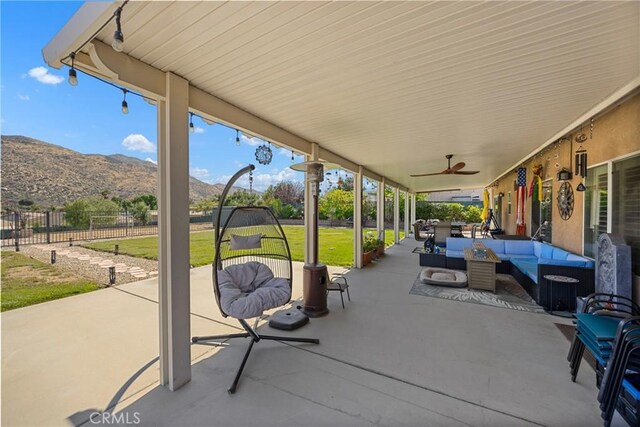1410 Charles St, Banning, CA 92220 - view of patio / terrace featuring an outdoor living space, a mountain view, and a ceiling fan
