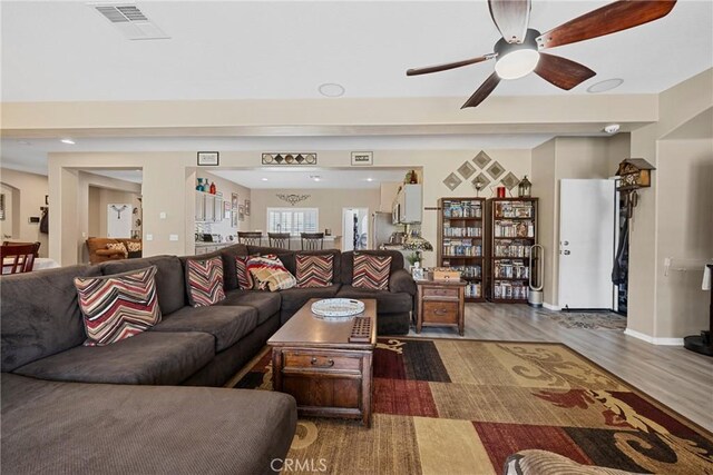 1410 Charles St, Banning, CA 92220 - living area featuring wood finished floors and ceiling fan