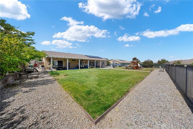 1410 Charles St, Banning, CA 92220 - fenced backyard with a patio area