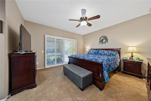 1410 Charles St, Banning, CA 92220 - bedroom featuring light colored carpet, access to exterior, and ceiling fan