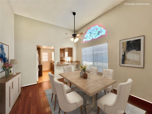 2014 W Hartford Pl Unit 58, Anaheim, CA 92801 - dining space featuring dark wood-type flooring, ceiling fan, and a high ceiling