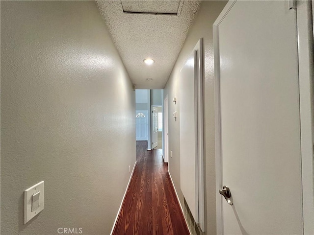 2014 W Hartford Pl Unit 58, Anaheim, CA 92801 - hall featuring dark wood-type flooring, a textured ceiling, and a textured wall