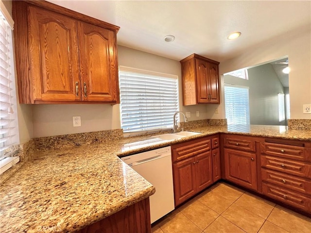 2014 W Hartford Pl Unit 58, Anaheim, CA 92801 - kitchen with white dishwasher, light tile patterned floors, brown cabinetry, and recessed lighting