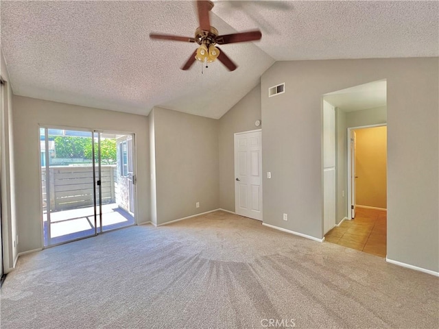 2014 W Hartford Pl Unit 58, Anaheim, CA 92801 - empty room featuring a ceiling fan, a textured ceiling, light colored carpet, and lofted ceiling