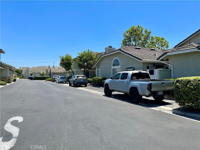 2014 W Hartford Pl Unit 58, Anaheim, CA 92801 - view of asphalt road featuring a residential view and curbs