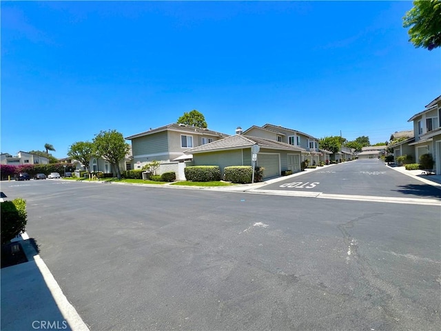 2014 W Hartford Pl Unit 58, Anaheim, CA 92801 - view of asphalt road featuring a residential view