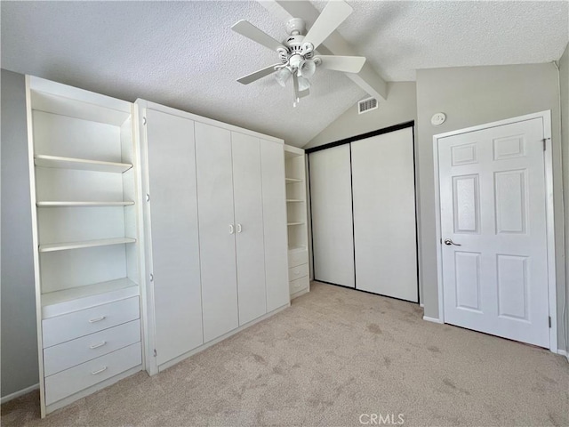 2014 W Hartford Pl Unit 58, Anaheim, CA 92801 - unfurnished bedroom with light colored carpet, a textured ceiling, and a ceiling fan