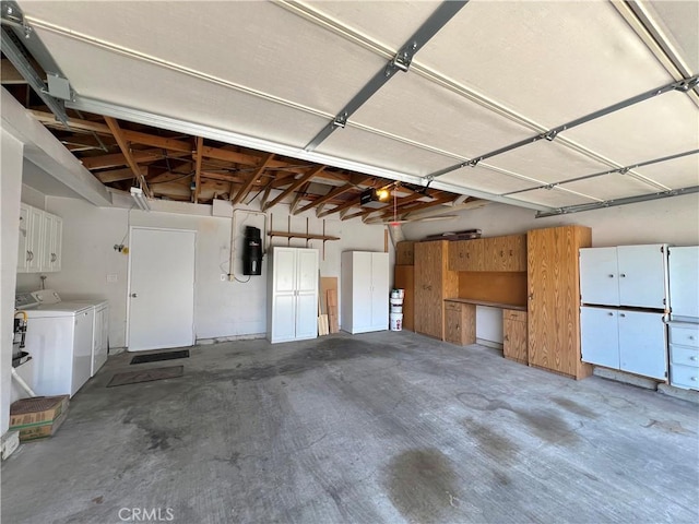 2014 W Hartford Pl Unit 58, Anaheim, CA 92801 - garage with washer and clothes dryer and a garage door opener