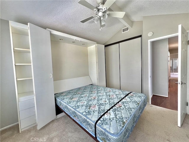 2014 W Hartford Pl Unit 58, Anaheim, CA 92801 - bedroom featuring carpet floors, a closet, a textured ceiling, and a ceiling fan