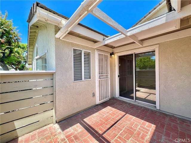 2014 W Hartford Pl Unit 58, Anaheim, CA 92801 - doorway to property featuring stucco siding and a patio area