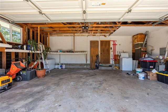 26865 Pine Canyon Rd, Lake Hughes, CA 93532 - garage featuring washer / dryer, a garage door opener, electric panel, and heating unit