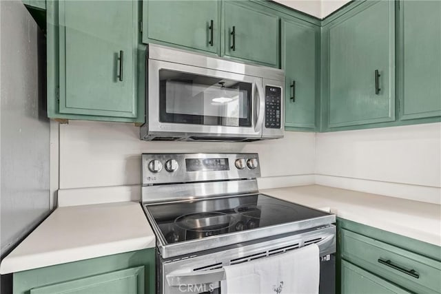 26865 Pine Canyon Rd, Lake Hughes, CA 93532 - kitchen featuring green cabinetry, appliances with stainless steel finishes, and light countertops