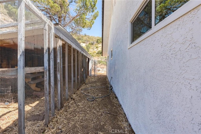 26865 Pine Canyon Rd, Lake Hughes, CA 93532 - view of property exterior featuring stucco siding and an outdoor structure