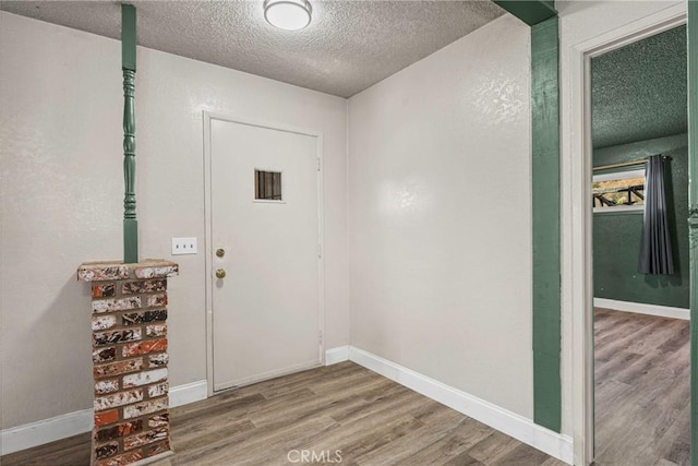26865 Pine Canyon Rd, Lake Hughes, CA 93532 - entryway with a textured ceiling and wood finished floors